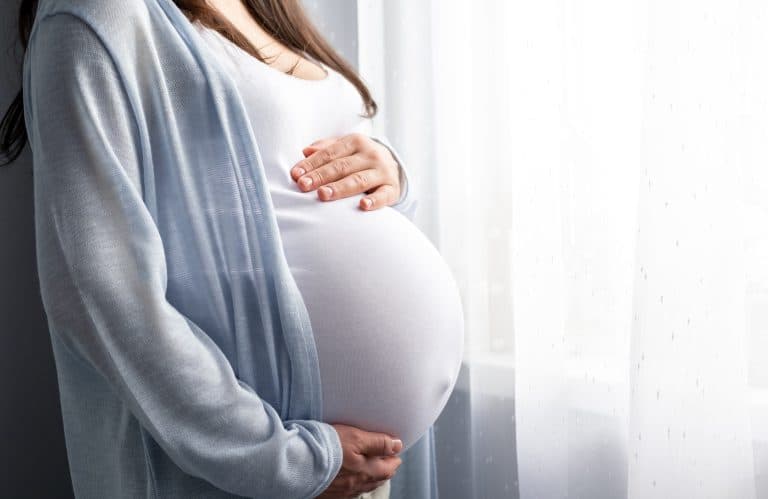 close-up image of a pregnant woman's stomach