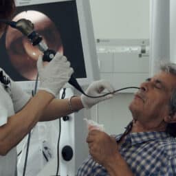 ENT provider performing a nasal endoscopy